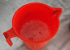 Mixture of hot water and soap powder